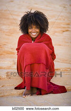 Portrait of a young woman wrapped in a towel, sitting View Large Photo Image Stock Image - Portrait of a young woman wrapped in a towel, sitting. Fotosearch