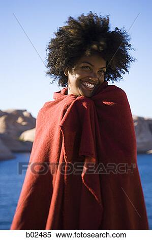 Stock Photography - Portrait of a young woman wrapped in a towel. Fotosearch