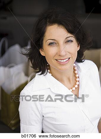 Portrait of an adult woman smiling View Large Photo Image Stock Photograph - Portrait of an adult woman smiling. Fotosearch
