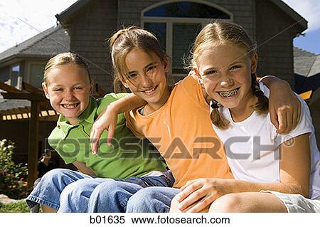 Portrait of three girls sitting on a trampoline View Large Photo Image Stock Photography - Portrait of three girls sitting on a trampoline. Fotosearch