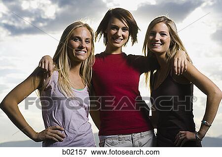 Portrait of three young women smiling View Large Photo Image Stock Photo - Portrait of three young women smiling. Fotosearch