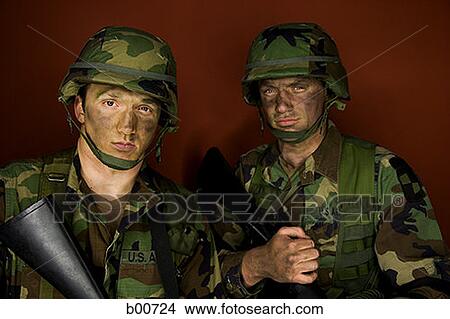 Portrait of two army soldiers holding rifles View Large Photo Image Picture - Portrait of two army soldiers holding rifles. Fotosearch