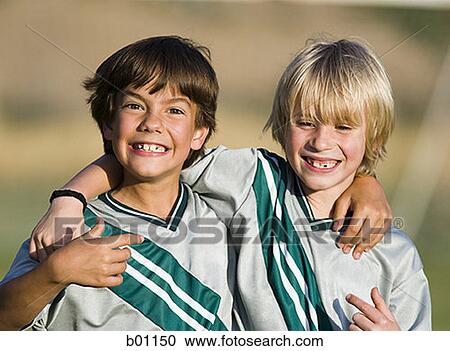 Portrait of two boys in football jerseys View Large Photo Image Stock Image - Portrait of two boys in football jerseys. Fotosearch