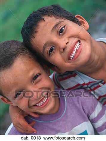 Stock Photo - Portrait of two boys smiling. Fotosearch