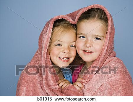 Portrait of two girls under a blanket and smiling View Large Photo Image Stock Photography - Portrait of two girls under a blanket and smiling. Fotosearch