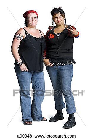 Portrait of two young biker chicks smiling View Large Photo Image Stock Photo - Portrait of two young biker chicks smiling. Fotosearch