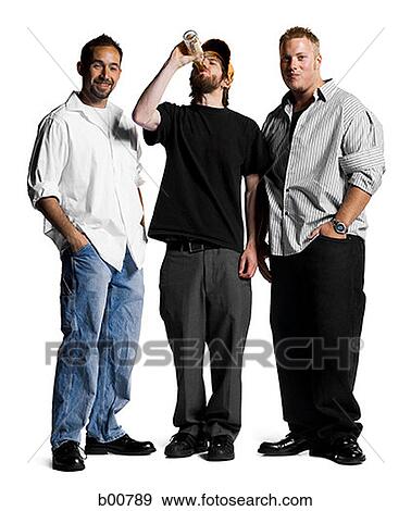 Portrait of two young men standing with a young man drinking View Large Photo Image Stock Photo - Portrait of two young men standing with a young man drinking. Fotosearch