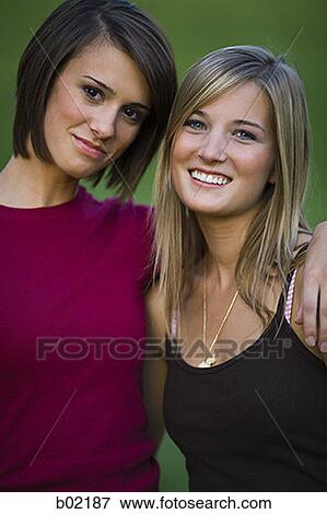 Portrait of two young women smiling View Large Photo Image Stock Photo - Portrait of two young women smiling. Fotosearch