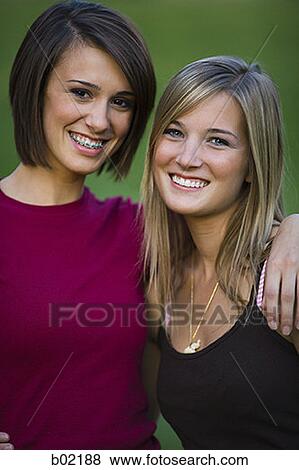 Portrait of two young women smiling View Large Photo Image Stock Photo - Portrait of two young women smiling. Fotosearch