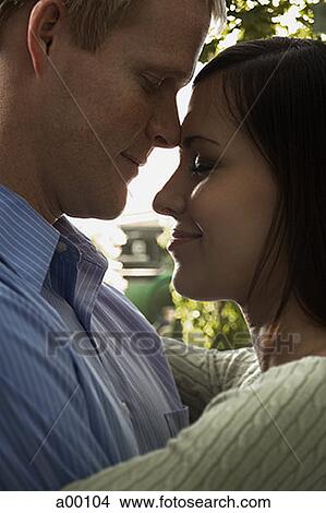 Picture - Profile of a couple embracing each other. Fotosearch
