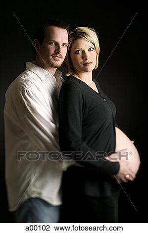 Profile of a man hugging a pregnant woman View Large Photo Image Stock Image - Profile of a man hugging a pregnant woman. Fotosearch