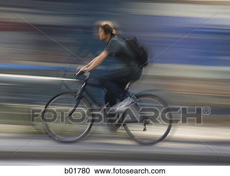 Profile of a man riding a bicycle View Large Photo Image Stock Image - Profile of a man riding a bicycle. Fotosearch