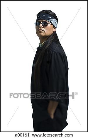 Stock Image - Profile of a mature man standing with his hands in his pockets. Fotosearch
