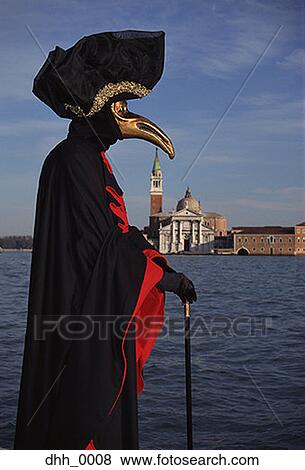 Stock Photo - Profile of a person standing in a masquerade costume. Fotosearch