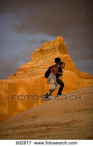 Profile of a young couple walking View Large Photo Image Stock Photo - Profile of a young couple walking. Fotosearch