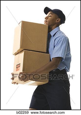 Profile of a young man carrying cardboard boxes View Large Photo Image Stock Photo - Profile of a young man carrying cardboard boxes. Fotosearch