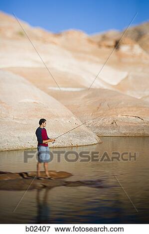 Stock Photo - Profile of a young man fishing. Fotosearch