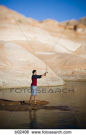 Stock Photograph - Profile of a young man fishing. Fotosearch