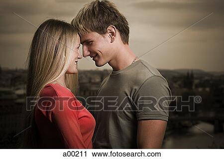 Profile of a young man looking at a young woman View Large Photo Image Stock Image - Profile of a young man looking at a young woman. Fotosearch