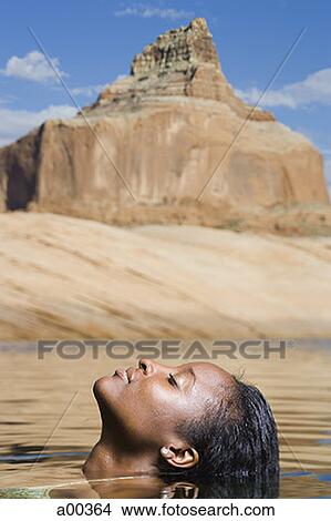 Profile of a young woman in a lake View Large Photo Image Picture - Profile of a young woman in a lake. Fotosearch