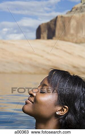 Profile of a young woman in a lake View Large Photo Image Stock Image - Profile of a young woman in a lake. Fotosearch