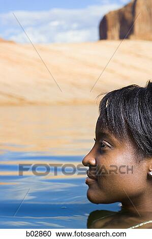 Profile of a young woman in water View Large Photo Image Stock Image - Profile of a young woman in water. Fotosearch