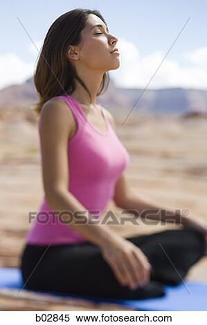 Profile of a young woman meditating View Large Photo Image Stock Photography - Profile of a young woman meditating. Fotosearch
