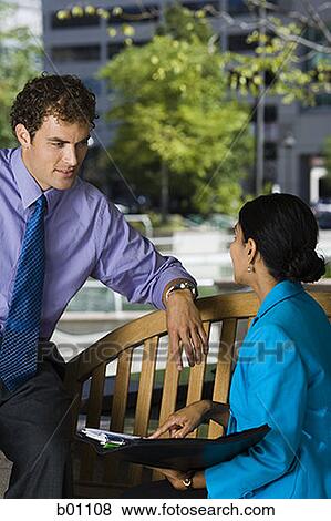 Profile of two business executives in a discussion View Large Photo Image Stock Photo - Profile of two business executives in a discussion. Fotosearch