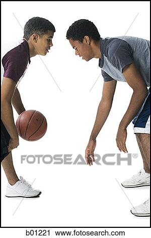Profile of two young men playing basketball View Large Photo Image Stock Image - Profile of two young men playing basketball. Fotosearch