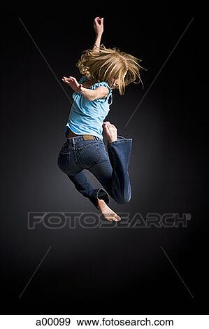 Rear view of a blonde girl jumping View Large Photo Image Stock Photo - Rear view of a blonde girl jumping. Fotosearch