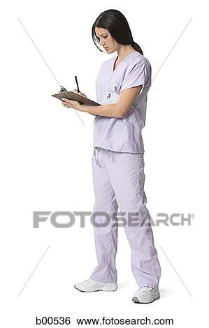 Side profile of a female nurse writing on a clipboard View Large Photo Image Stock Photograph - Side profile of a female nurse writing on a clipboard. Fotosearch