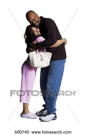 Side profile of a mid adult couple embracing each other View Large Photo Image Stock Image - Side profile of a mid adult couple embracing each other. Fotosearch