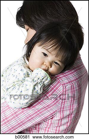 Side profile of a mother carrying her daughter View Large Photo Image Stock Image - Side profile of a mother carrying her daughter. Fotosearch