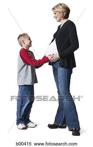 Side profile of a pregnant woman with her son touching her stomach View Large Photo Image Stock Photography - Side profile of a pregnant woman with her son touching her stomach. Fotosearch