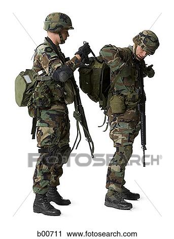 Side profile of an army soldier adjusting the backpack of another soldier View Large Photo Image Stock Image - Side profile of an army soldier adjusting the backpack of another soldier. Fotosearch