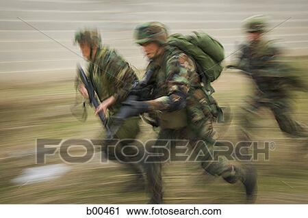 Side profile of three soldiers running on a field View Large Photo Image Stock Image - Side profile of three soldiers running on a field. Fotosearch