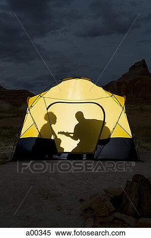 Silhouette of a couple sitting inside a tent View Large Photo Image Stock Photography - Silhouette of a couple sitting inside a tent. Fotosearch