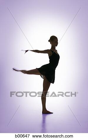 Stock Photo - Silhouette of a female ballerina performing ballet. Fotosearch