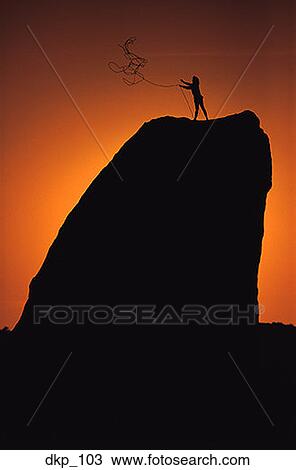 Silhouette of a person standing on the top of a rock throwing out a rope View Large Photo Image Stock Image - Silhouette of a person standing on the top of a rock throwing out a rope. Fotosearch