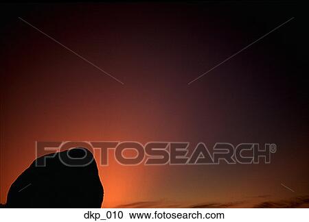 Silhouette of a rock formation at dusk View Large Photo Image Stock Image - Silhouette of a rock formation at dusk. Fotosearch