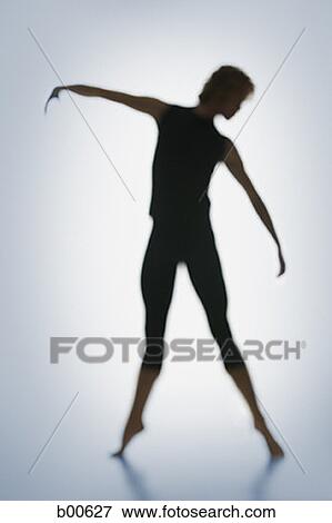 Stock Photo - Silhouette of a young man doing rhythmic gymnastics. Fotosearch
