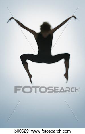 Silhouette of a young man jumping View Large Photo Image Stock Photo - Silhouette of a young man jumping. Fotosearch