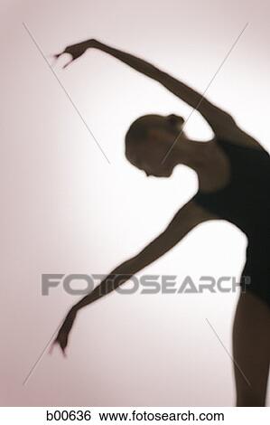 Silhouette of a young woman dancing View Large Photo Image Stock Photograph - Silhouette of a young woman dancing. Fotosearch