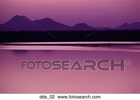 Silhouette of mountains at dusk View Large Photo Image Stock Image - Silhouette of mountains at dusk. Fotosearch
