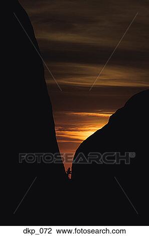 Silhouette of rock formations at dusk View Large Photo Image Stock Image - Silhouette of rock formations at dusk. Fotosearch