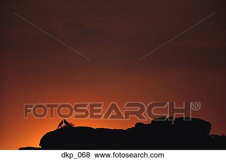 Silhouette of rock formations at dusk View Large Photo Image Stock Photo - Silhouette of rock formations at dusk. Fotosearch
