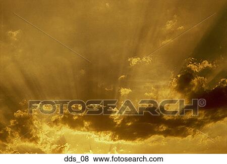 Stock Photo - Sunlight coming through clouds. Fotosearch