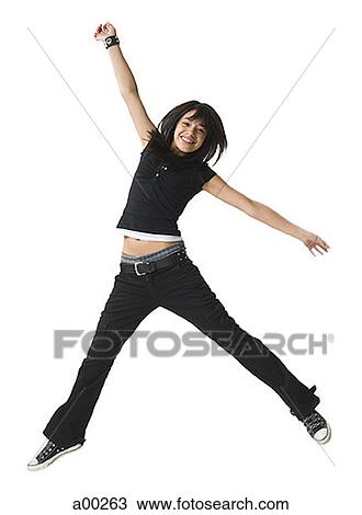 Teenage girl jumping with her arm outstretched View Large Photo Image Stock Image - Teenage girl jumping with her arm outstretched. Fotosearch