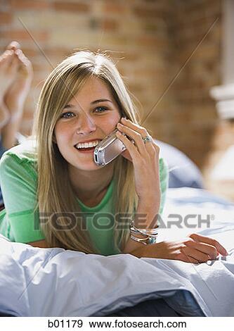 Teenage girl talking on a mobile phone View Large Photo Image Stock Photo - Teenage girl talking on a mobile phone. Fotosearch