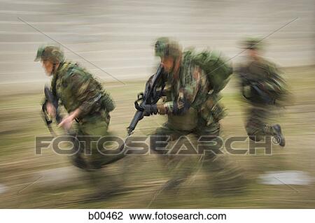 Three soldiers running on the field with their rifles View Large Photo Image Stock Image - Three soldiers running on the field with their rifles. Fotosearch